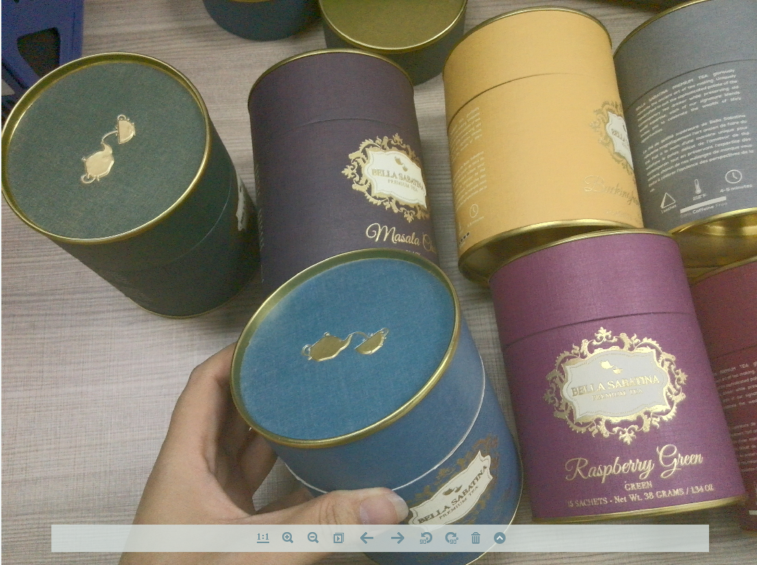 A batch of metal canisters with designs