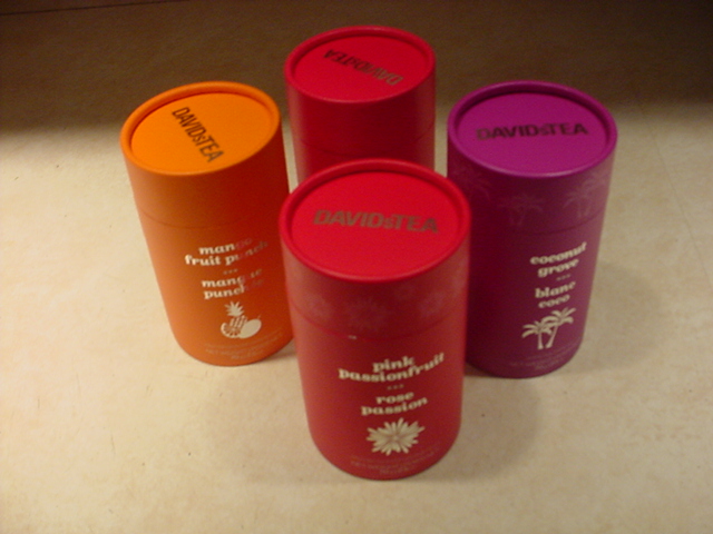 Orange, pink, and purple paper tubes with covers