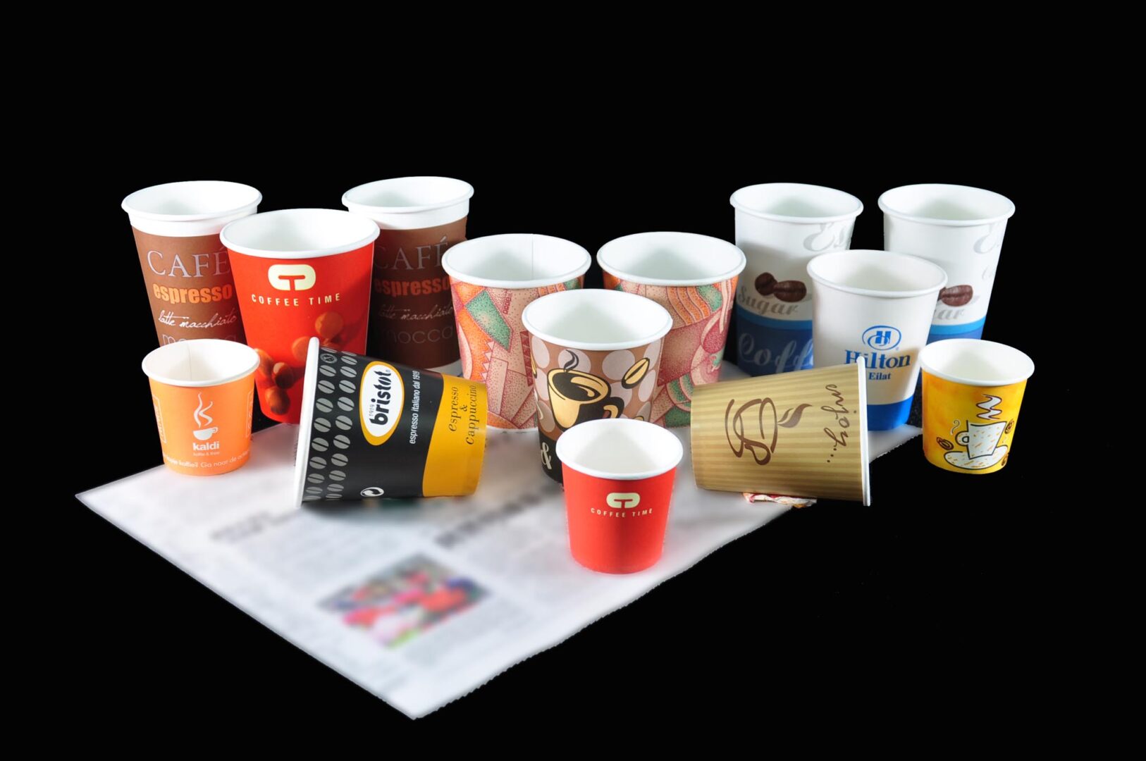 A bunch of paper cups with printed designs